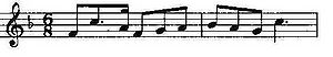 Musical notation showing a theme in F and in 6/8 time on a treble clef.