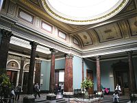 Oblong, domed room, the ceiling supported by brown marble columns