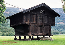 A small hut composed entirely of split logs, and raised above the ground on stout upright stumps.